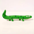 Green cartoon lizard-shaped dog chew toy with squeaker for aggressive chewers
