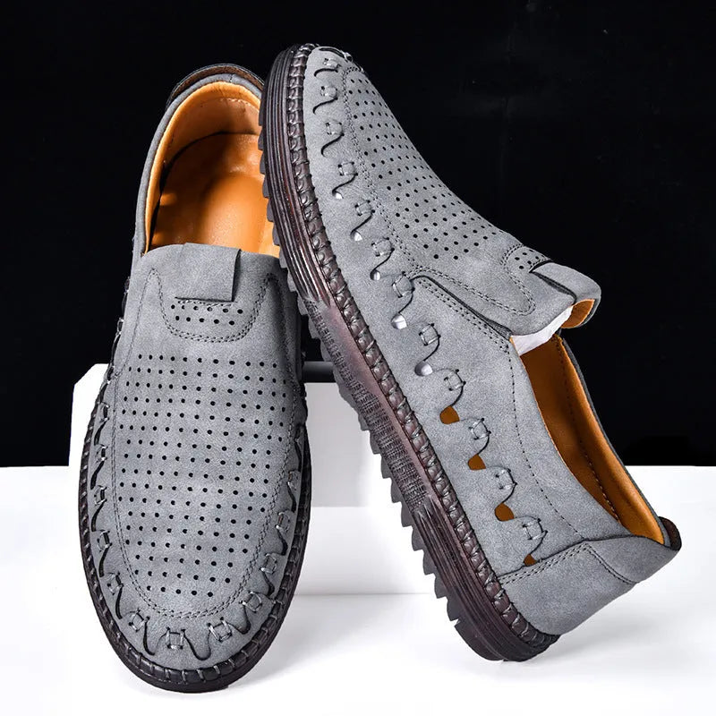 Men's brown casual slip-on shoes with round toe, flat heel, and sewn sole detailing.