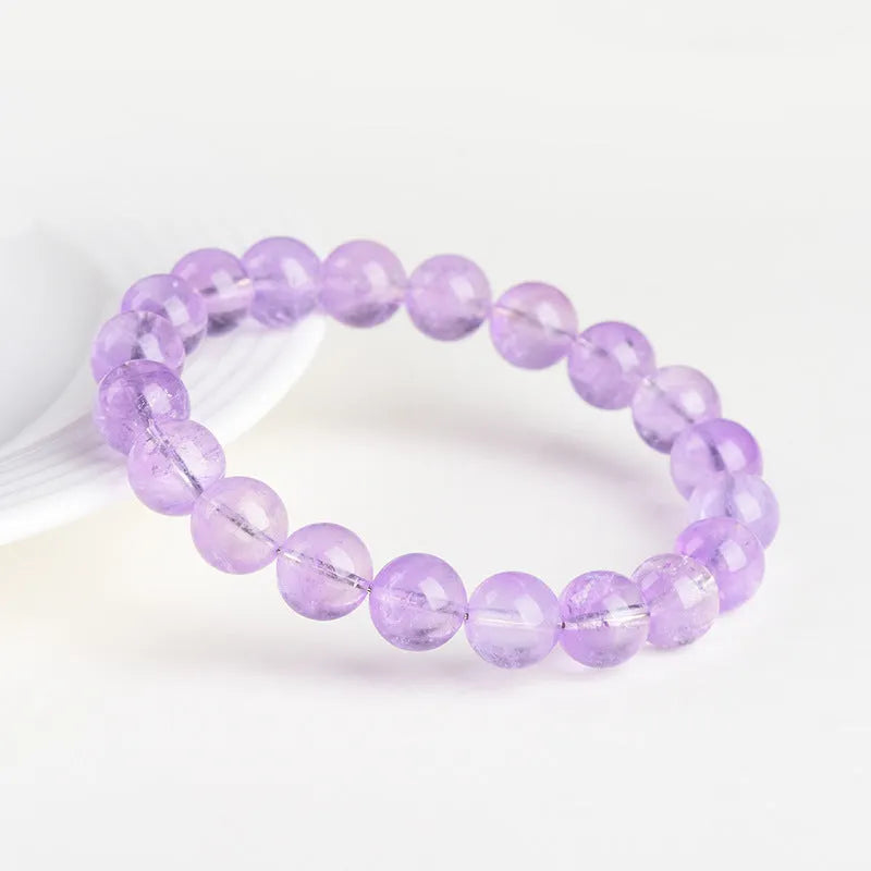 Amethyst crystal beaded bracelet with round lavender beads showing water ripple geometric pattern
