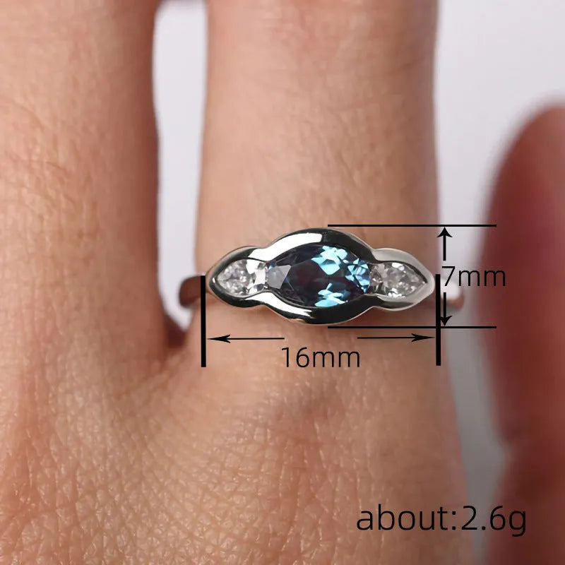 Women's geometric ellipse copper ring with white gold finish and inlaid zircon stones.