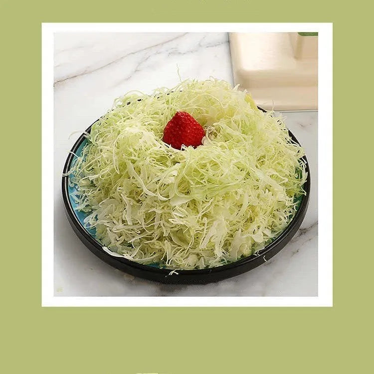 Beige kitchen vegetable slicer grater with stainless steel blades for spiralising and shredding