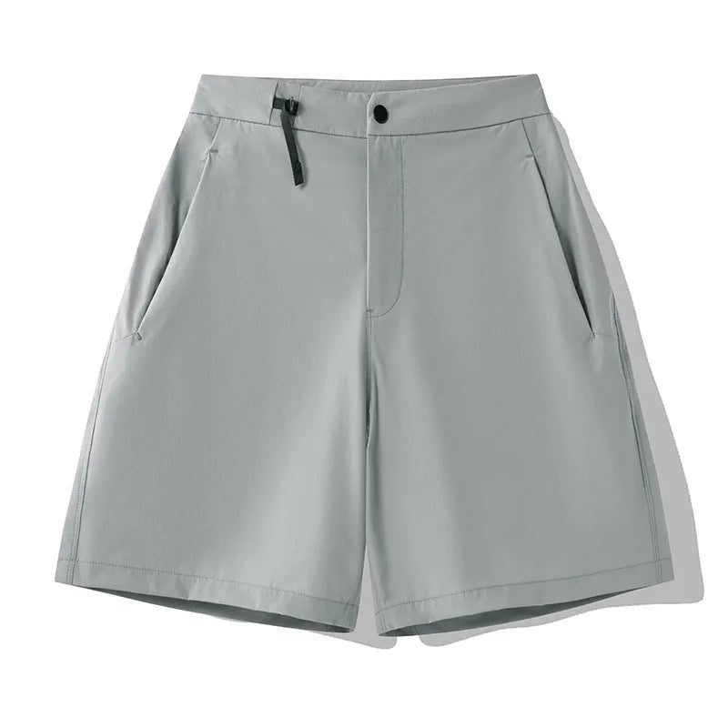 Men's solid colour quick-dry sports shorts with elastic waistband, shown in khaki.