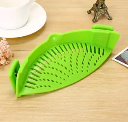 Silicone clip-on kitchen funnel strainer for draining liquids from pots with buckle attachment