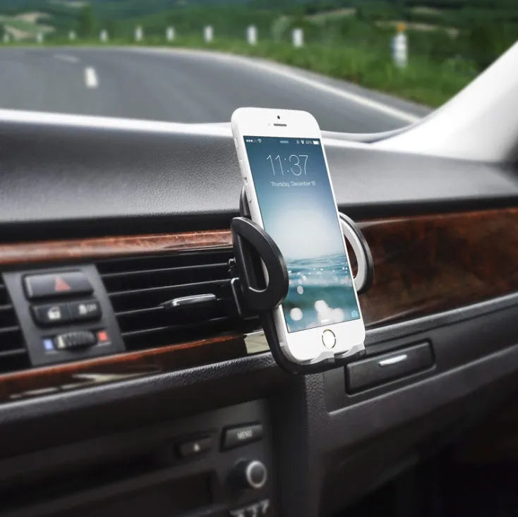 Black plastic car vent phone holder mounted on air conditioning outlet with smartphone