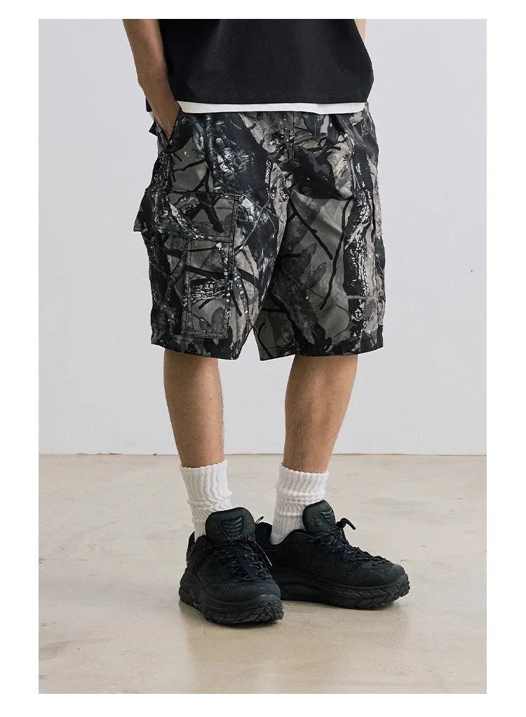 Loose straight-leg denim shorts in army green with a zip fly and elasticated mid-waist.