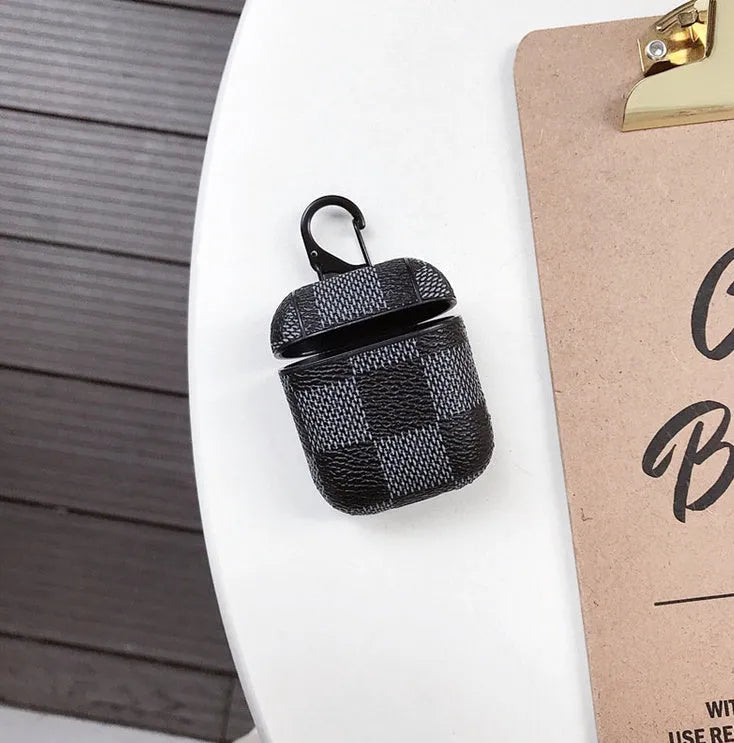 iPhone XS Max hard plastic case with grid texture and a small metal anti-lost hook attached at the corner.