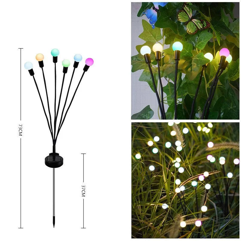 Solar-powered LED firefly lawn light with ground stake inserted in grass
