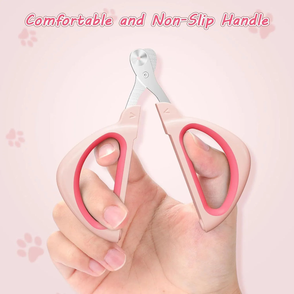 Close-up of a pink pet nail clipper showing the round positioning hole and stainless steel blade.