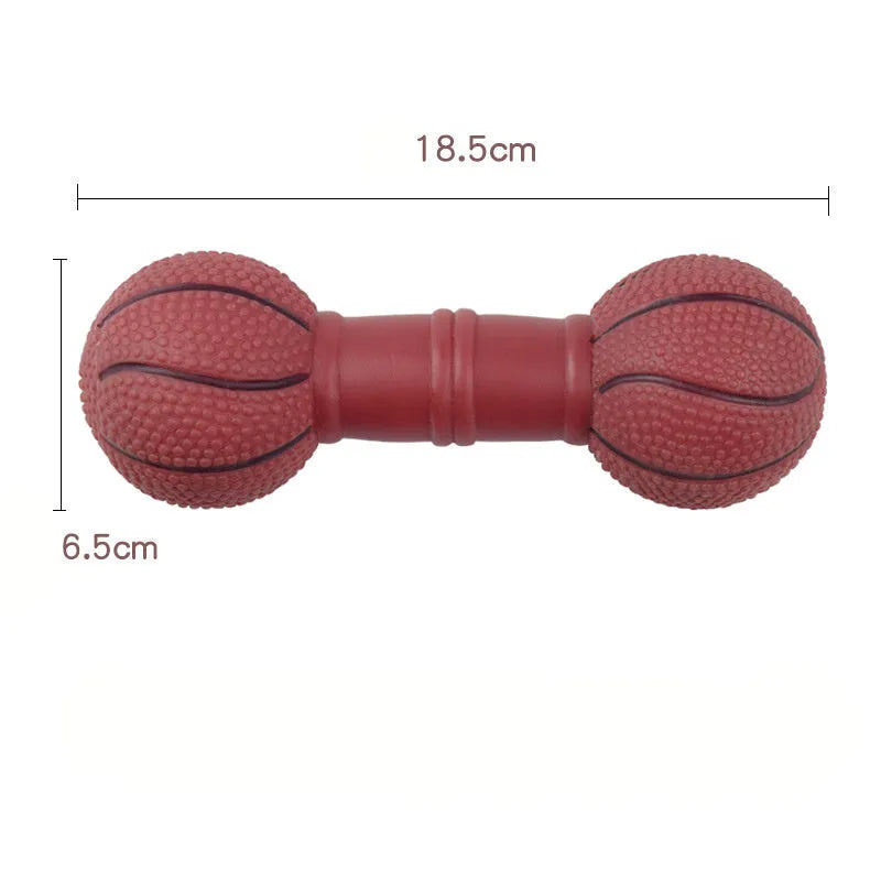 Brown orange white yellow PVC football dumbbell shaped squeaky dog chew toy on a plain background.