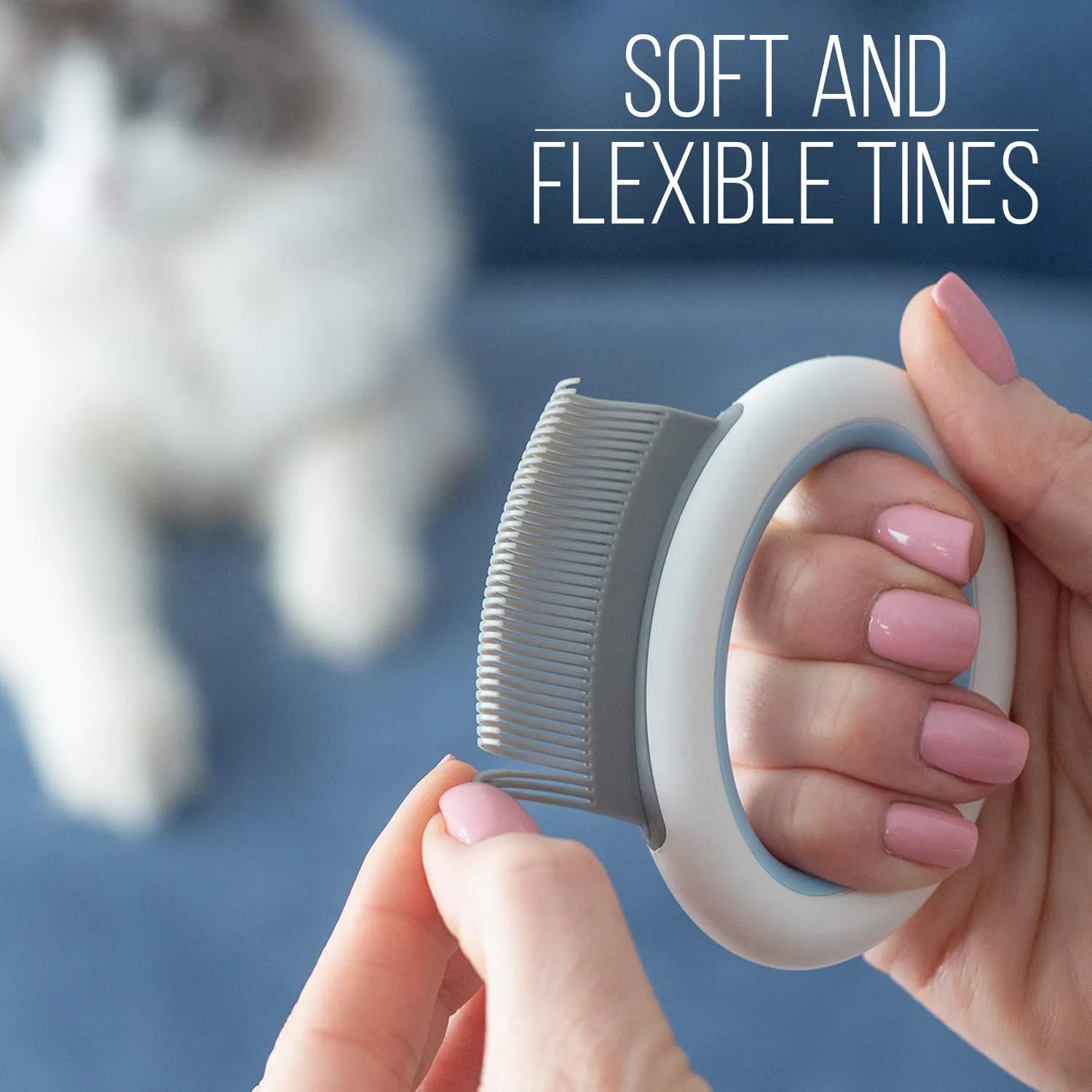 Blue, green, and pink pet grooming comb with ergonomic handle for deshedding cats and dogs.