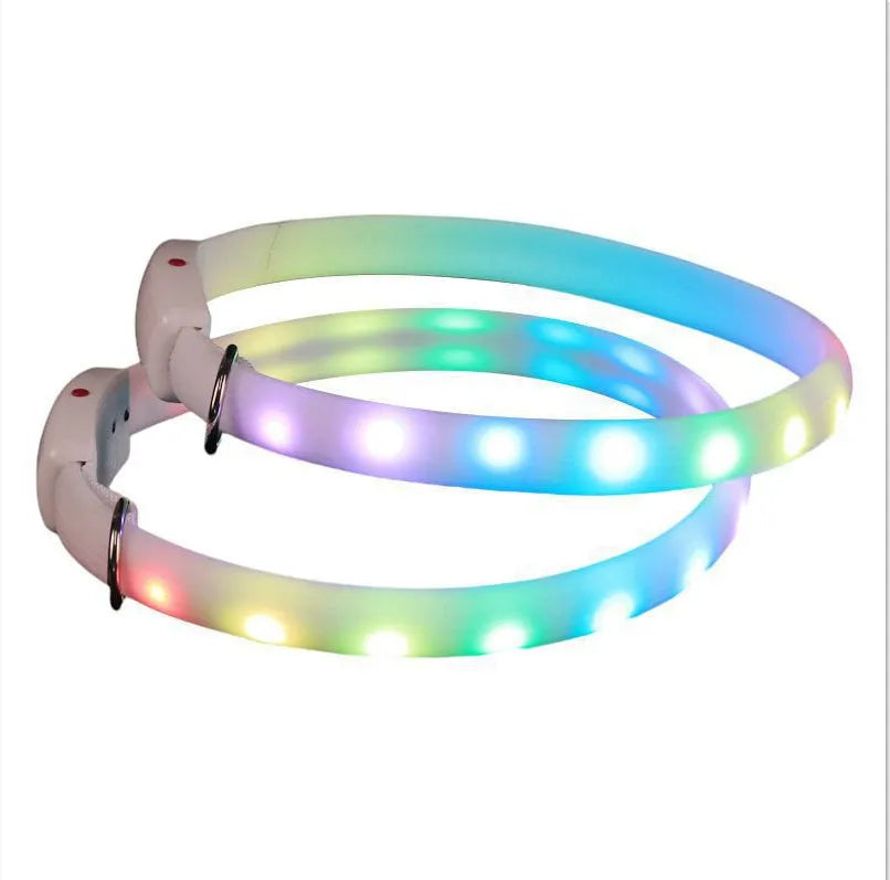 White USB rechargeable LED dog collar on a dark background, showing glowing tube and ABS switch