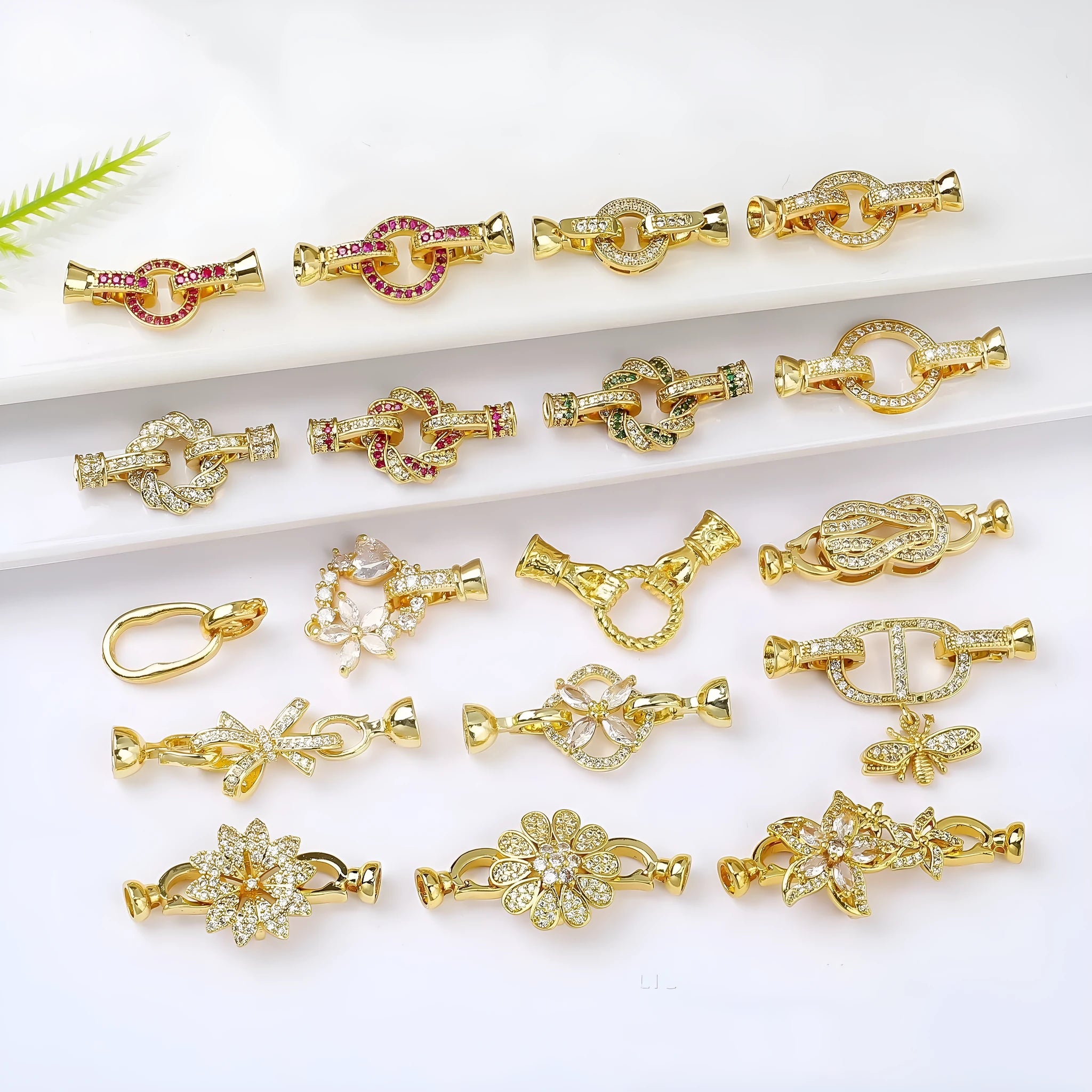 Small gold-coloured metal necklace clasp with a chain buckle for DIY jewellery making.