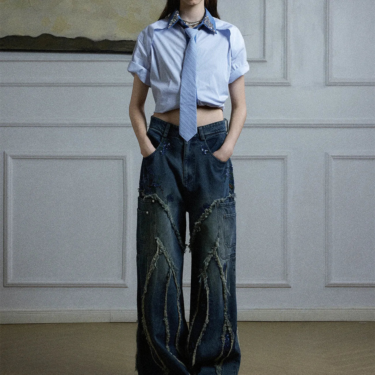 Men's blue and khaki patchwork striped shirt with diamond tie detail and quilted texture.