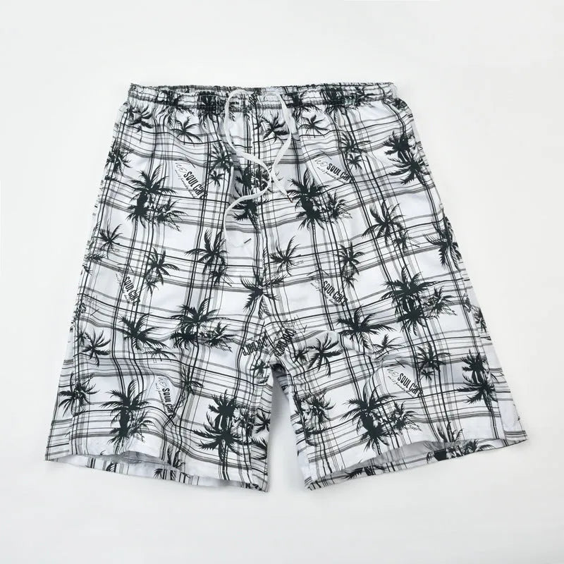 Men's casual floral print five-point swimming trunks made from polyester fabric.