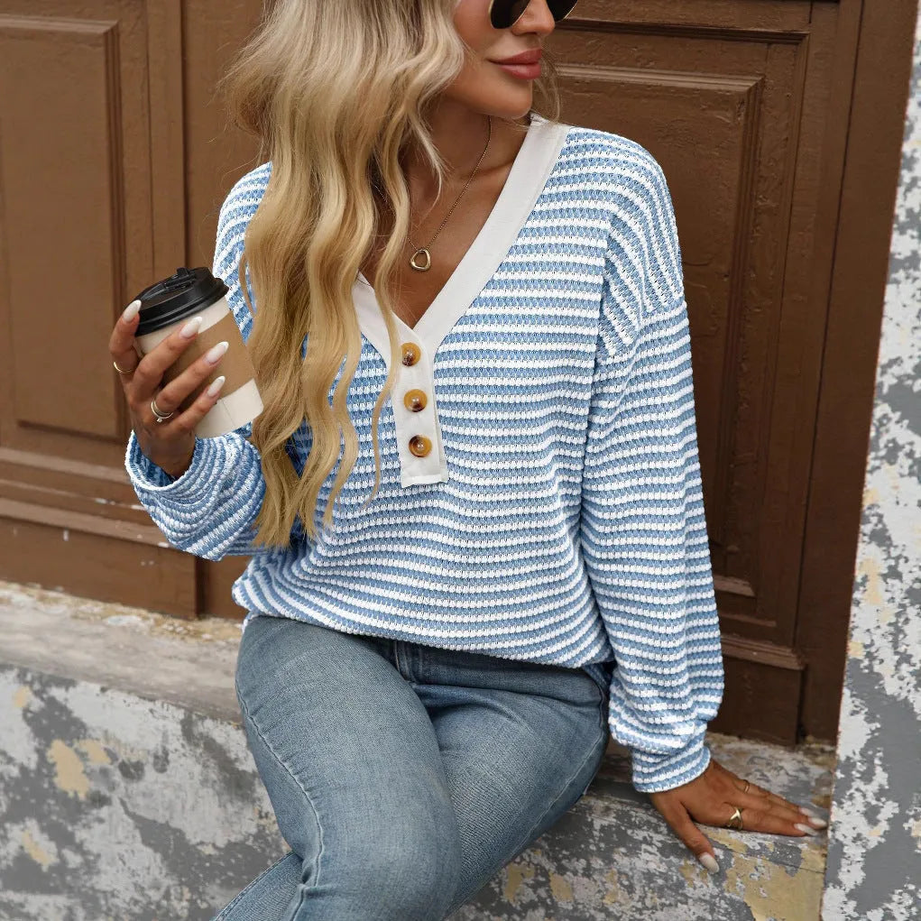 Women's loose fit patchwork V-neck pullover top with long sleeves and button fastenings.
