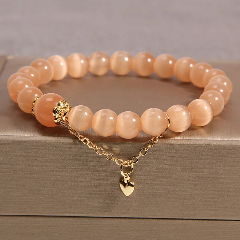 Women's multi-layer crystal bracelet with natural garnet, strawberry quartz, and moonstone pendants in Korean style.