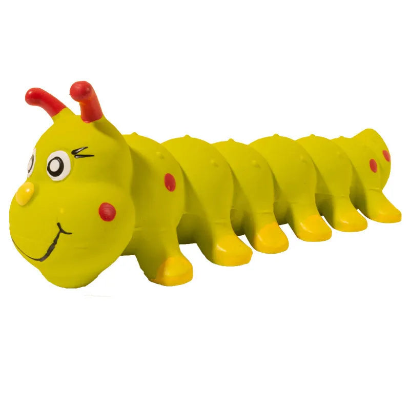 Yellow rubber caterpillar-shaped squeaky toy for dogs, shown next to a tape measure indicating 25.5cm length.