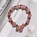 Handmade strawberry quartz crystal bracelet with hetian jade peach blossom elements in five style variations