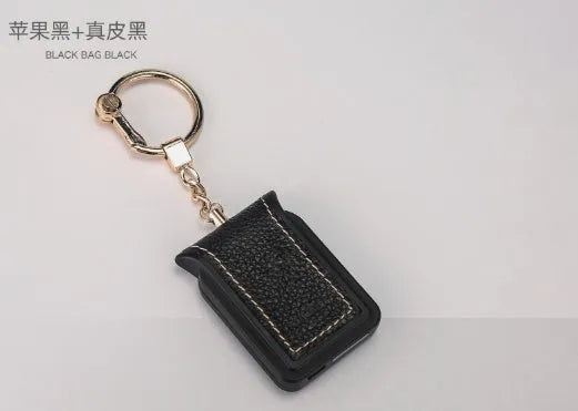 Black leather Bluetooth dual SIM adapter keychain for iOS phones with micro USB port.