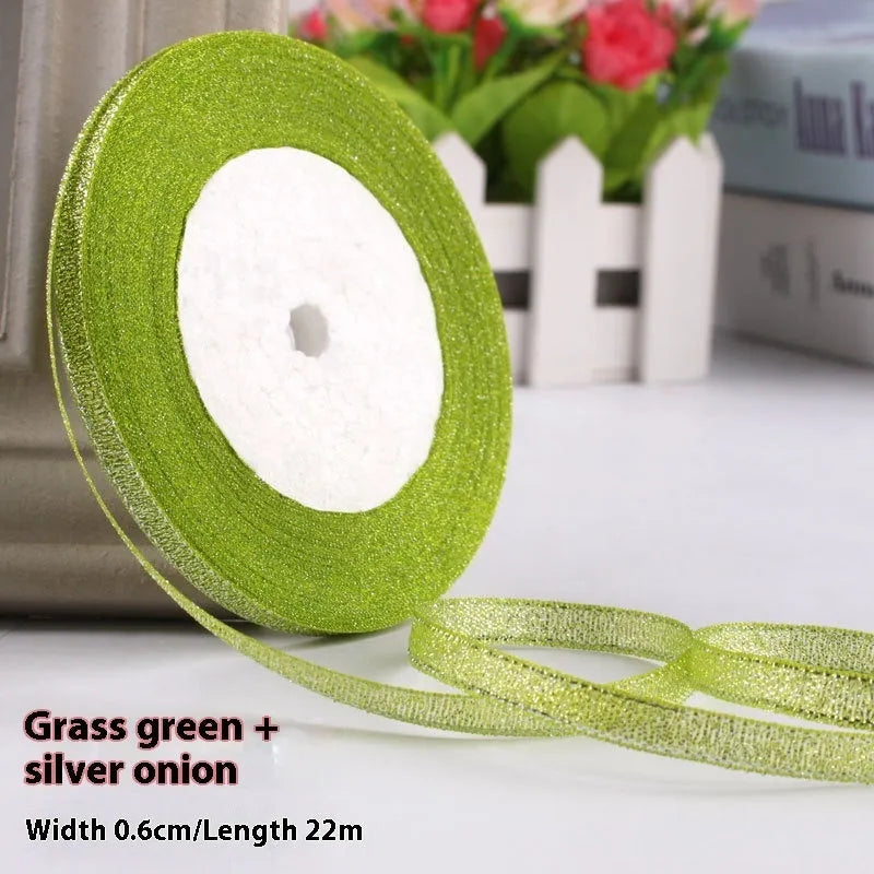 Roll of 0.6cm wide coloured polyester gift ribbon with 22 metre length.