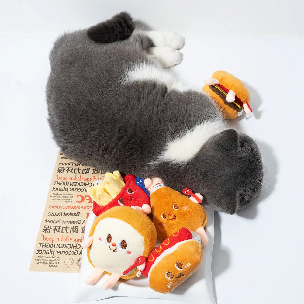 Assorted fast food shaped cat chewing toys including hamburger, chicken leg, bread, fries, and hot dog designs