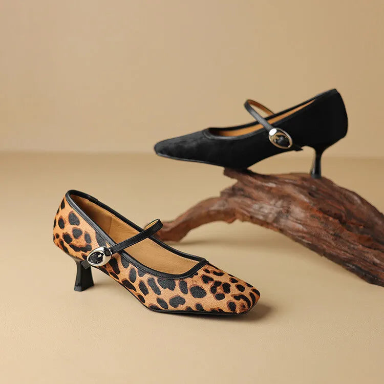 Women's black square toe stiletto ankle-strap heels with a horse hair upper and buckle fastening.