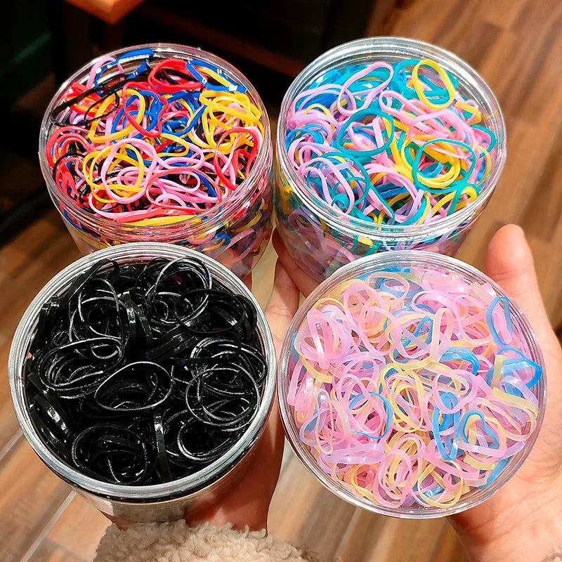 Multi-colour TPU baby hair ties for toddlers in a reusable storage container, 300 piece pack.