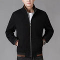 Men's grey polyester fleece jacket with long sleeves and a stick pocket, shown on a hanger.