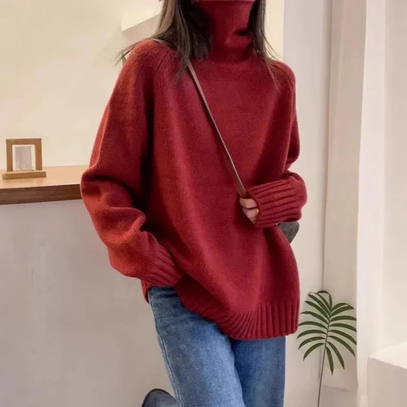 Women's thick loose-fit turtleneck sweater with curling pile collar in red, camel, grey, or black.