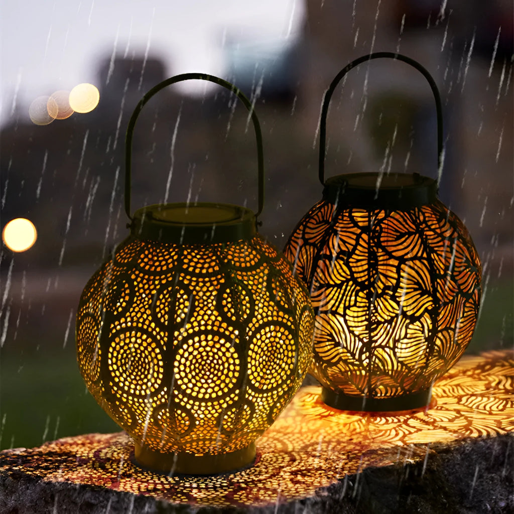 Solar courtyard lamp with hollow iron decorative design emitting warm white LED light