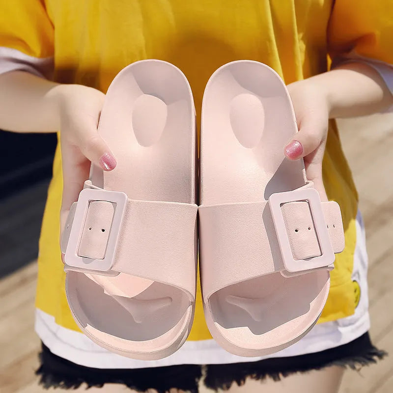 Grey Blue women's EVA flip-flop slippers with a silver buckle strap on a white background.
