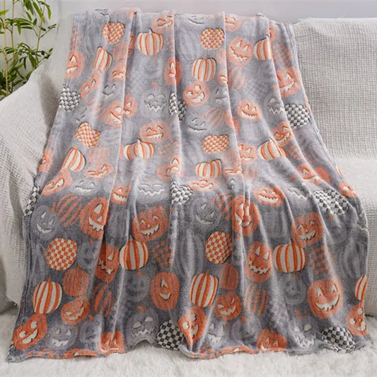 Children's cartoon flannel blanket in colourful design on bed