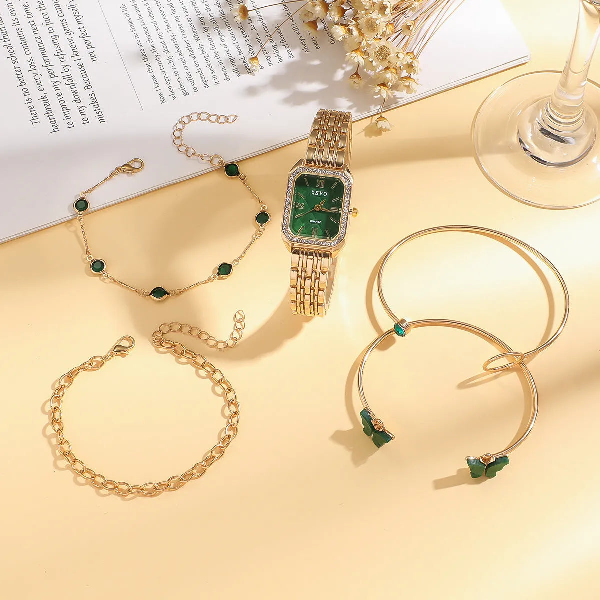 Gold green square women's watch with four matching bracelets showing jewellery buckle and 25mm dial