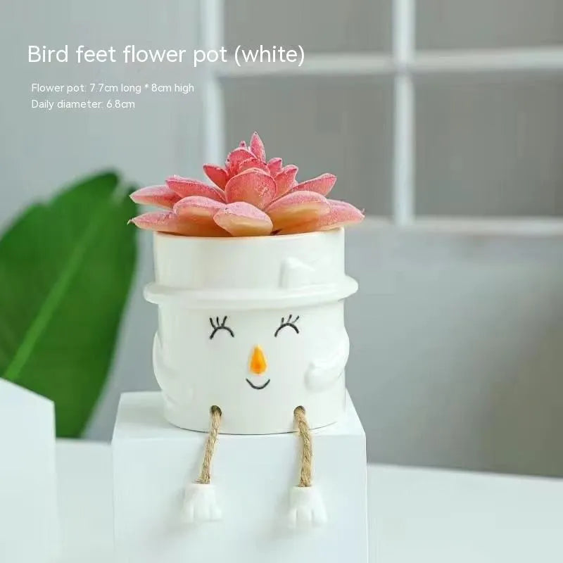 Ceramic hanging foot flowerpot in a cartoon style for desktop succulents.