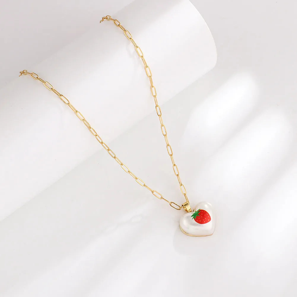 Geometric heart fruit pendant necklace with adjustable chain showing strawberry, pineapple, apple designs