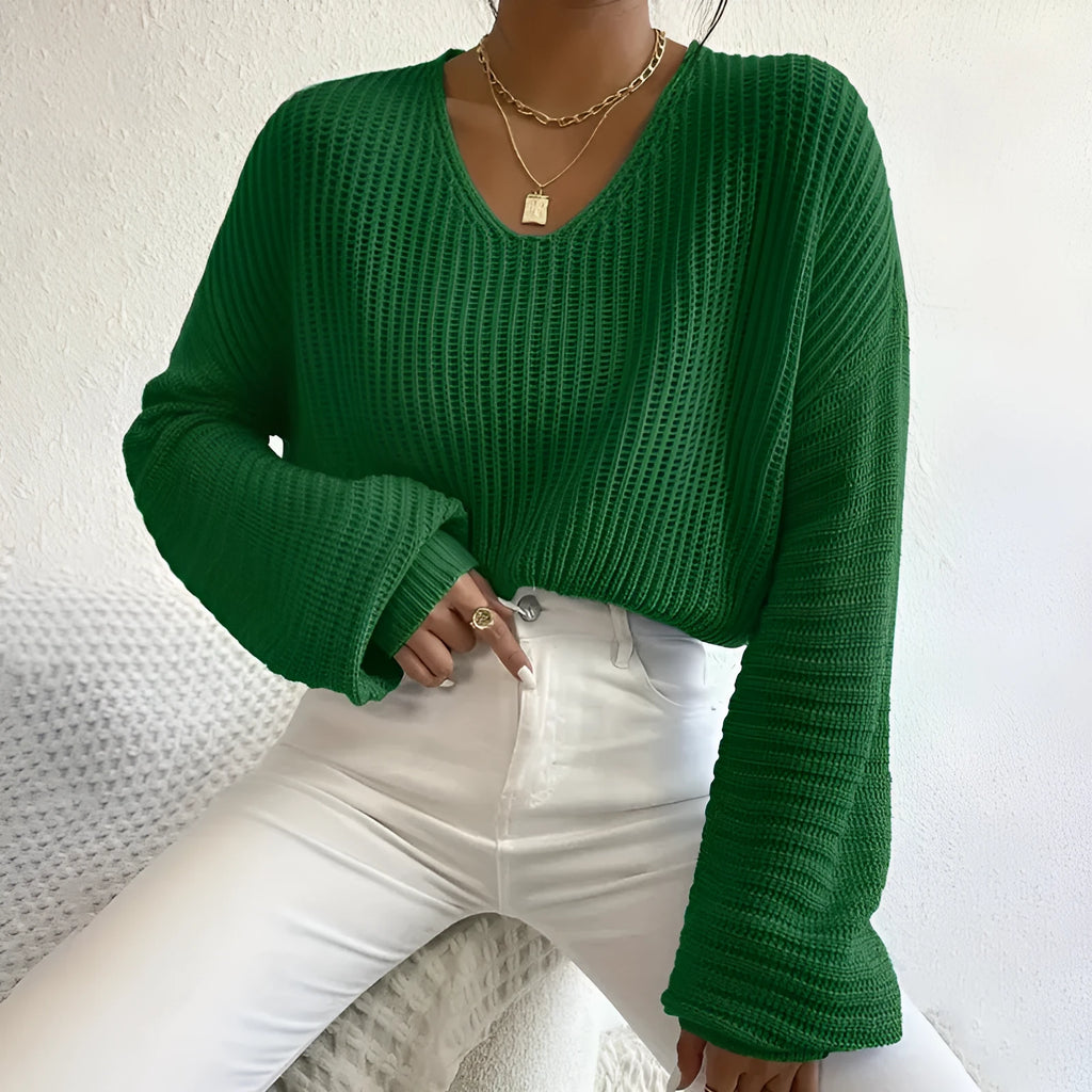 Women's solid colour long sleeve loose pullover in black, pink, green, blue, or red.