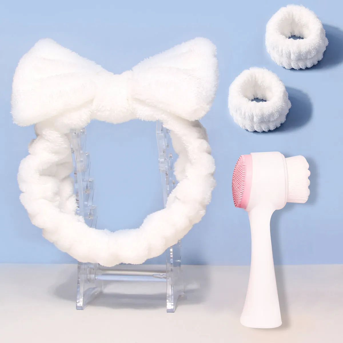 Facial brush and coral fleece hair band set in purple colour with plastic handle and nylon bristles