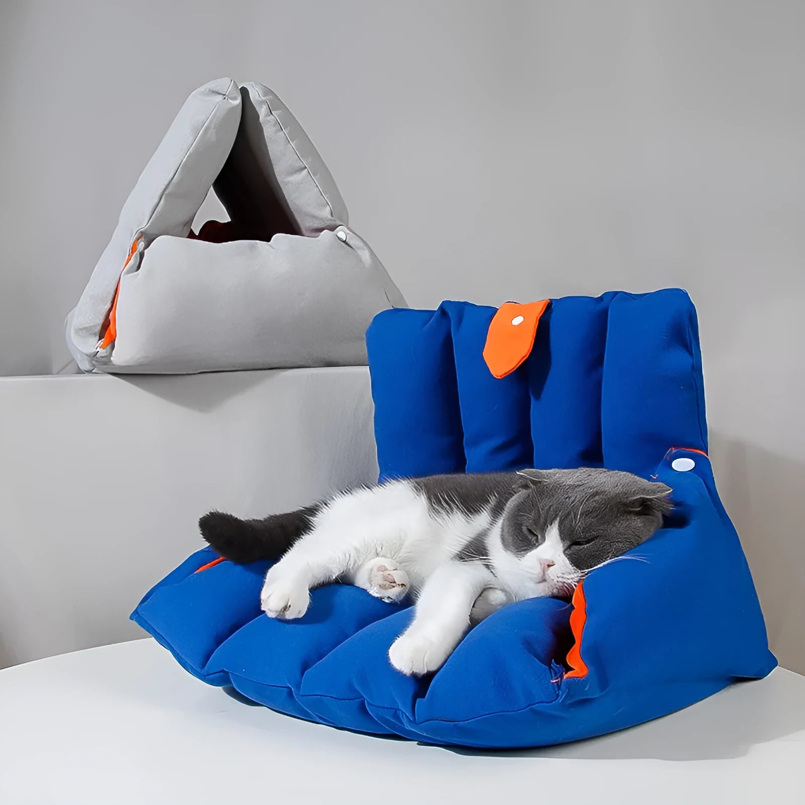 Blue triangular cotton cat bed with a removable cover, showing drilled holes on the side for combination.