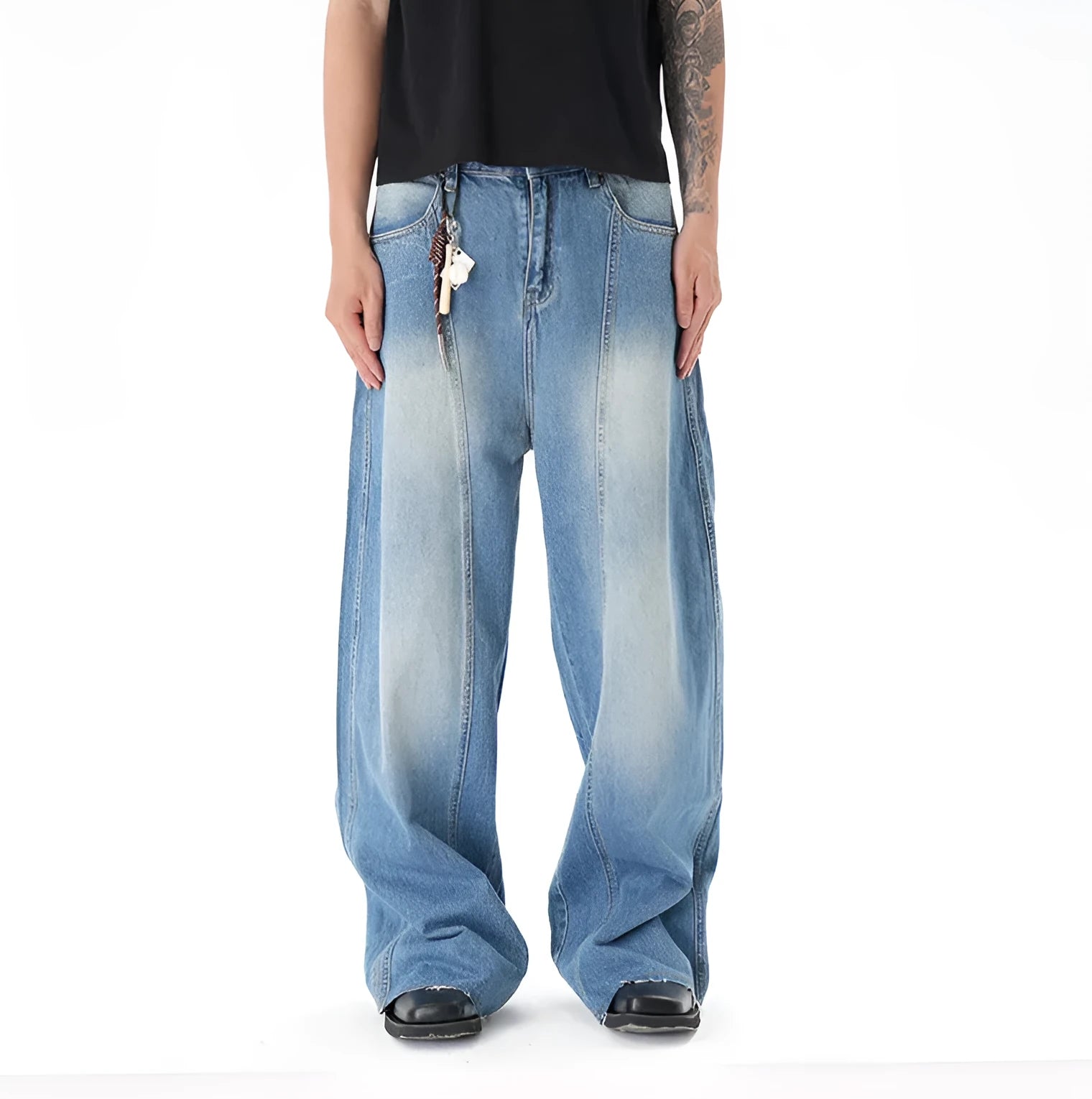 Light blue vintage wash wide leg denim jeans on a model, showing the relaxed fit and zip fly.