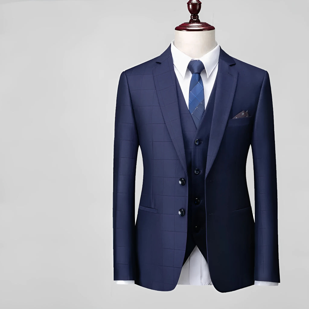 Men's navy blue three-piece slim fit plaid suit with jacket, vest, and trousers on hanger