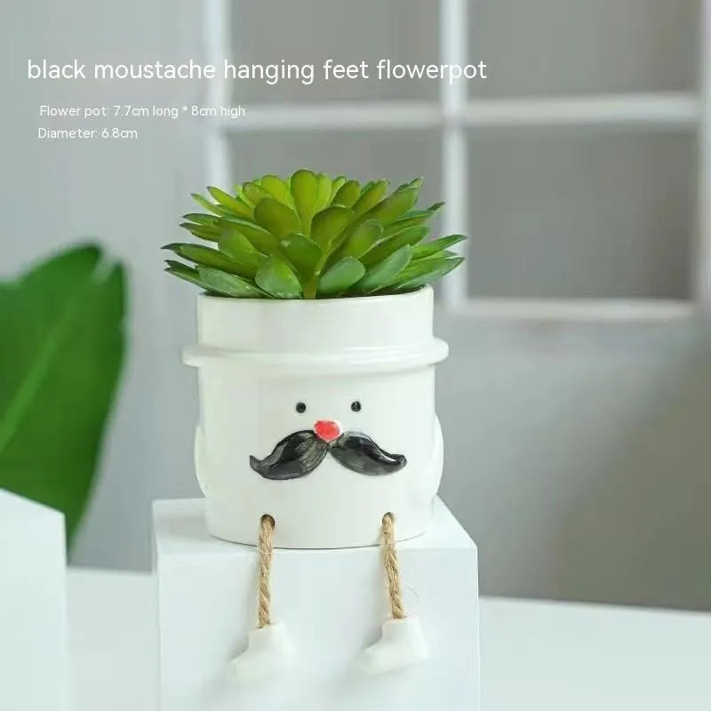 Ceramic hanging foot flowerpot in a cartoon style for desktop succulents.