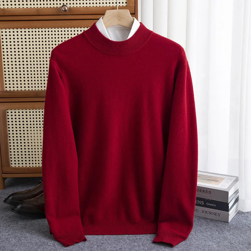 Man wearing a half-collar loose wool sweater in a textured rough yarn knit.