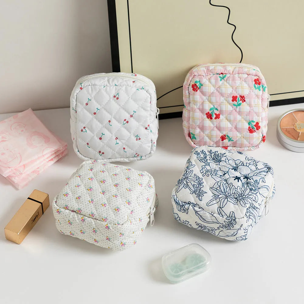 Women's floral patterned polyester key storage bag with sewing thread detail.