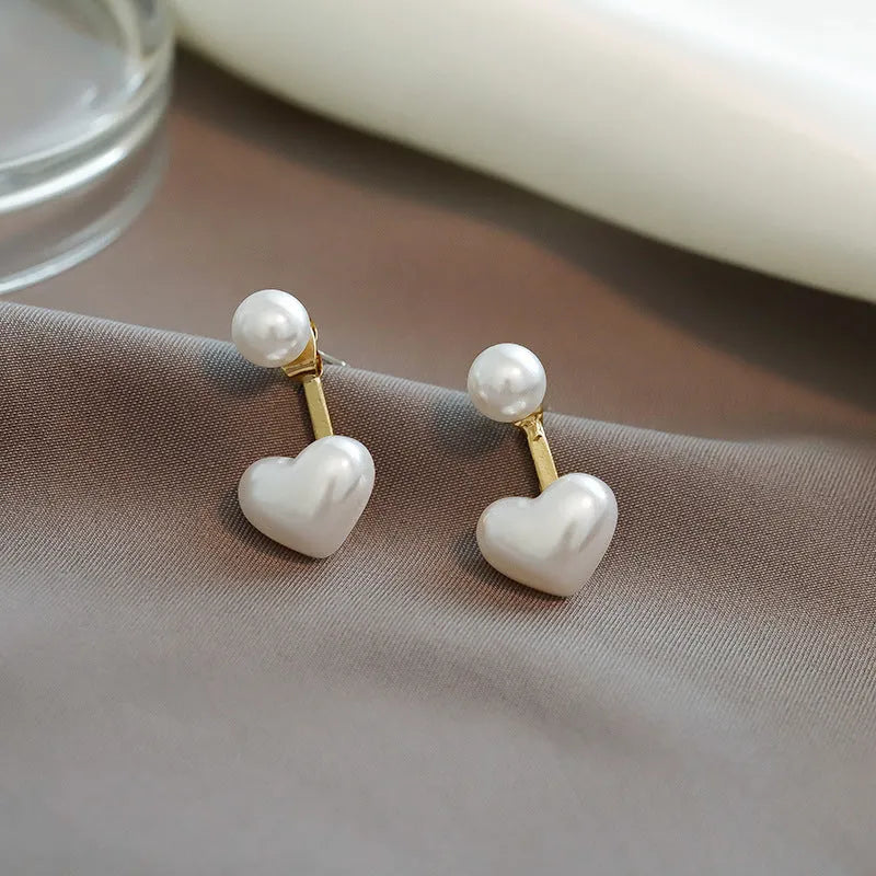 Women's heart-shaped pearl stud earrings with alloy construction and electroplated finish