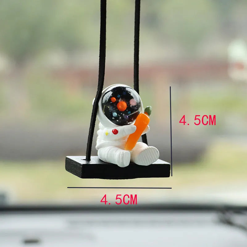 Resin cartoon astronaut car pendant available in red flag, telescope, and radish holding styles for dashboard decoration.