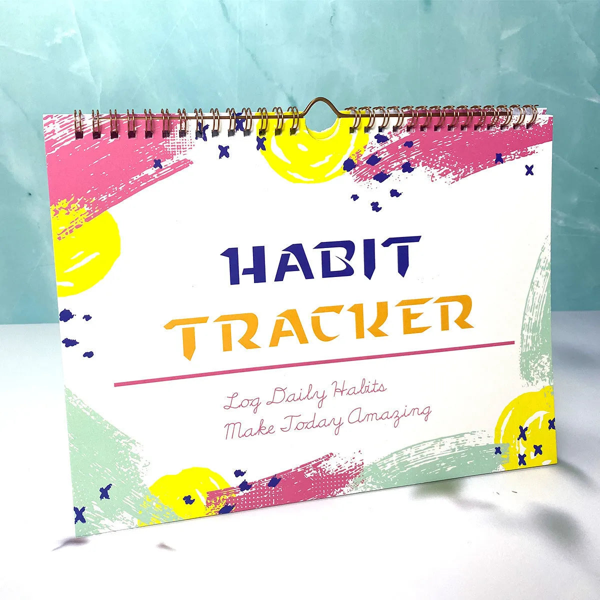 English habit tracking notebook with 12 pages in A4 21cm by 28cm format showing colour options