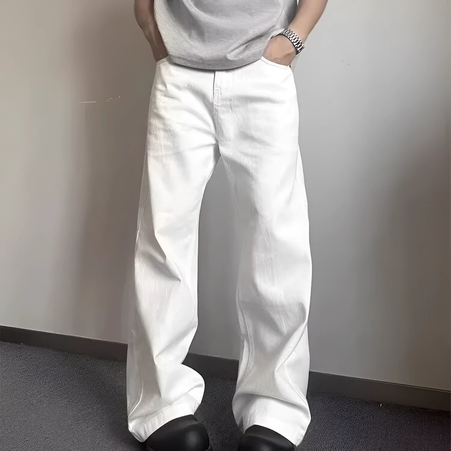 Men's white loose straight-leg cotton denim jeans with wide cut and zipper fly