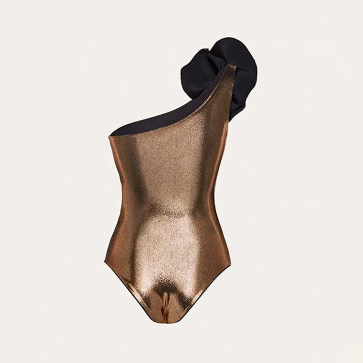 Gold coloured handmade one-piece swimsuit with halter neck and hollow out pattern.