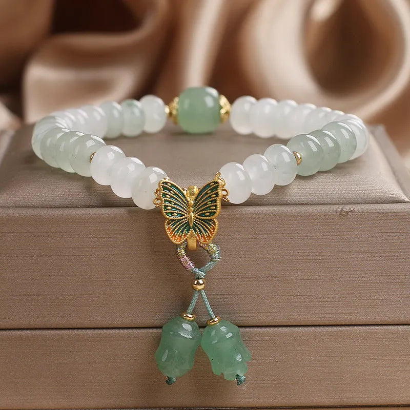 Green crystal women's bracelet with Tian Shan Cui abacus beads and retro butterfly tassel design