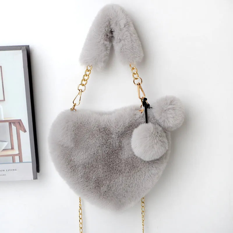 Soft plush heart-shaped women's handbag in medium size with zipper closure